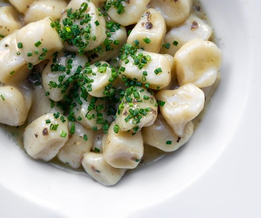 Il Venetian signature dishes Gnocchi al TartufoCostoletta di Vitello (Veal Chop)Branzino